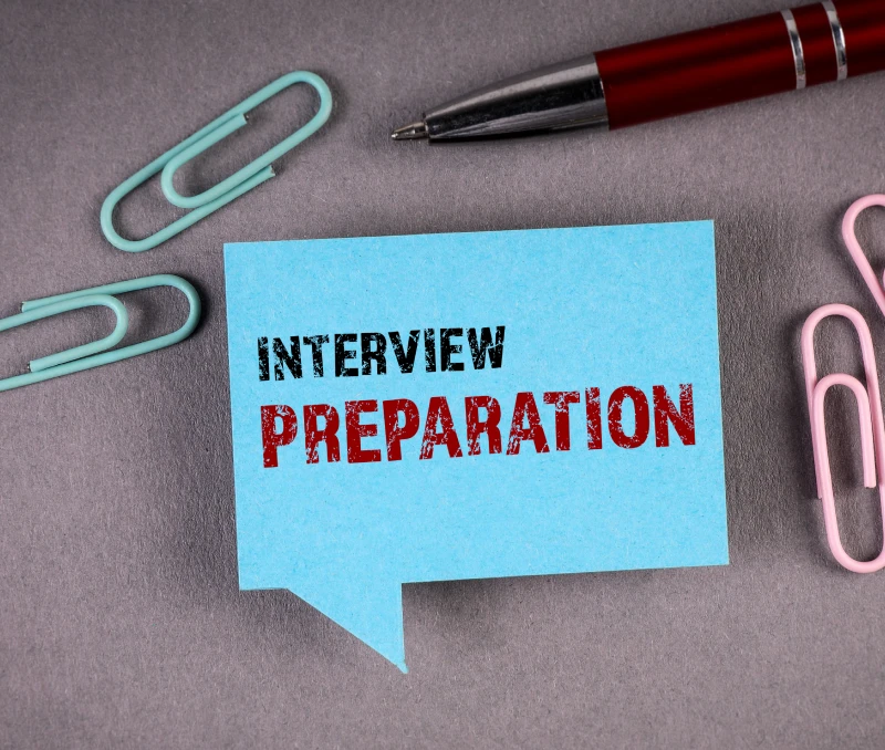 Interview preparation note with paperclips
